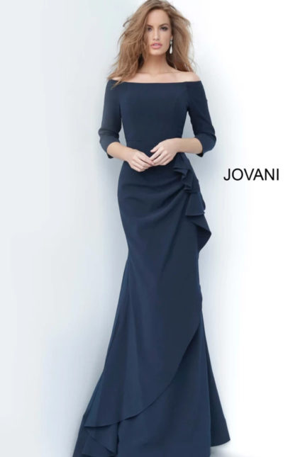 Model wearing Jovani 00446 navy dress with mermaid silhouette and off-the-shoulder neckline.