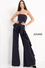 Model wearing Jovani 00778 with a strapless neckline and ruffled detailing in navy.