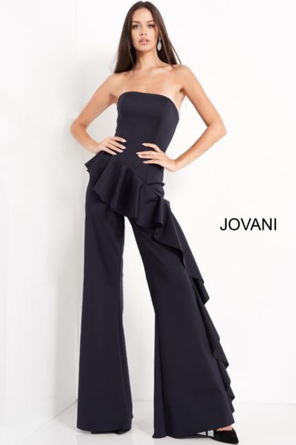 Model wearing Jovani 00778 with a strapless neckline and ruffled detailing in navy.