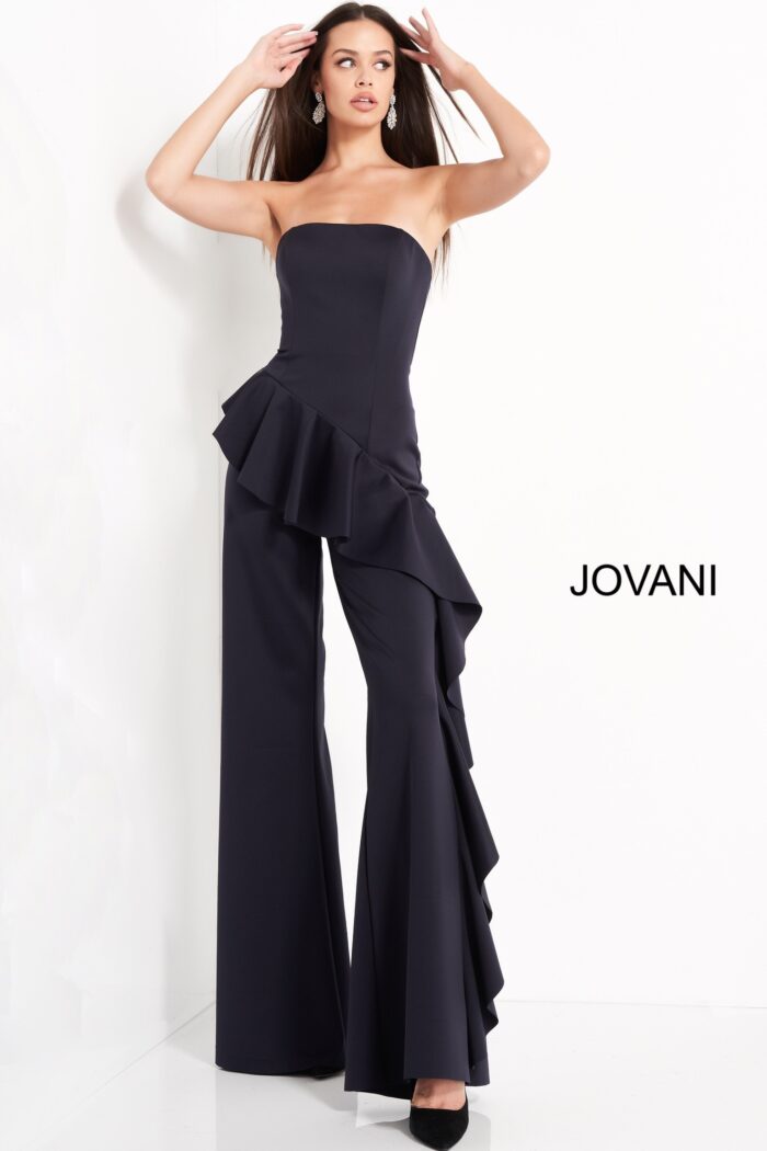 Model wearing Jovani 00778 Navy Strapless Ruffle Evening Jumpsuit