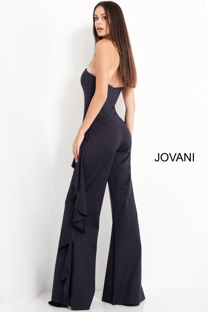 Model wearing Jovani 00778 Navy Strapless Ruffle Evening Jumpsuit
