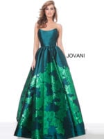 Model wearing Jovani 02038 green ball gown with floral embroidery.