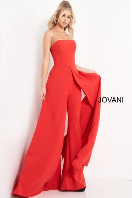 Model wearing Jovani 03529 red jumpsuit, angled front view, highlighting strapless neckline and flowing wide-leg style.