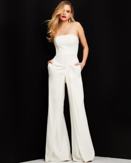 Model wearing Jovani 03828 ivory strapless jumpsuit front view with wide-leg pants.