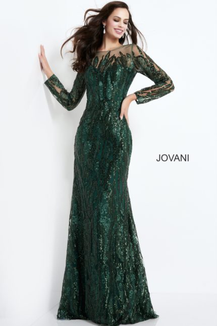 Model wearing Jovani 03936 emerald gown with long sleeves and intricate beading.