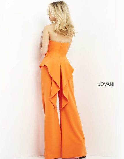 Model wearing Jovani 04427 orange jumpsuit, back view