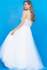 model wearing Jovani K02229 blue gown with elegant tulle back design