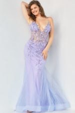 Plus model in Jovani 05839 elegant blush mermaid gown, front view.