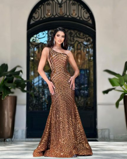 Model wearing Jovani 06017 in bronze, featuring a single-shoulder neckline and full-length mermaid silhouette.