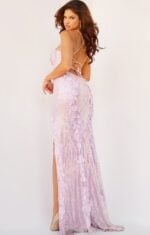 model wearing 06109 ice pink gown with open back and tied lace-up detail