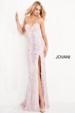 model wearing 06109 ice pink gown with floral details and high side slit