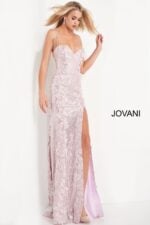 model wearing 06109 ice pink gown with thin straps and high slit