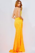 Back view of model in Jovani 06450 yellow gown.