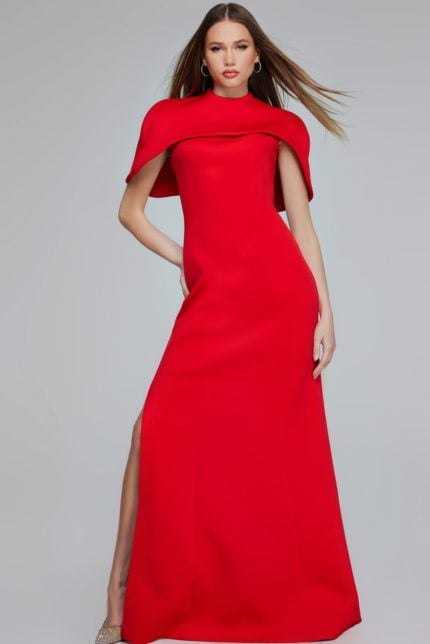 Model wearing Jovani 06538 elegant red floor-length dress with high neckline and cape sleeves.