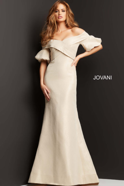 Model wearing Jovani 06831 beige dress, front view, showcasing mermaid silhouette and off-the-shoulder neckline.