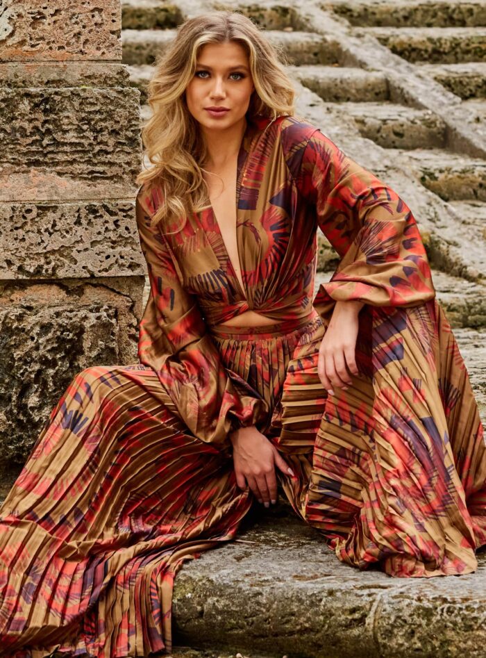 Model wearing Jovani 06851 and 06852 Brown Print Two Piece Long Sleeve Set