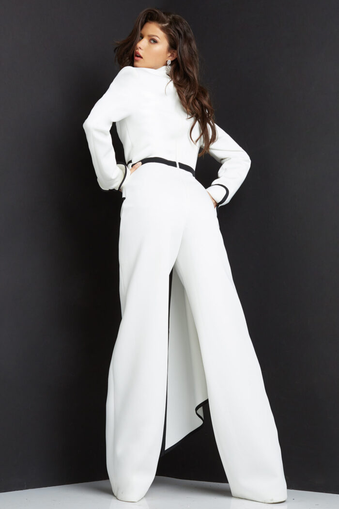 Model wearing Jovani 06917 White Black Long Sleeve Plunging Neck Jumpsuit