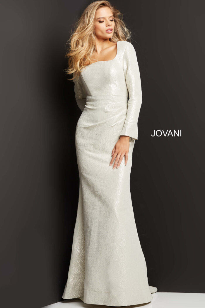 Model wearing Jovani 06996 Cobalt Metallic Long Sleeve Gown
