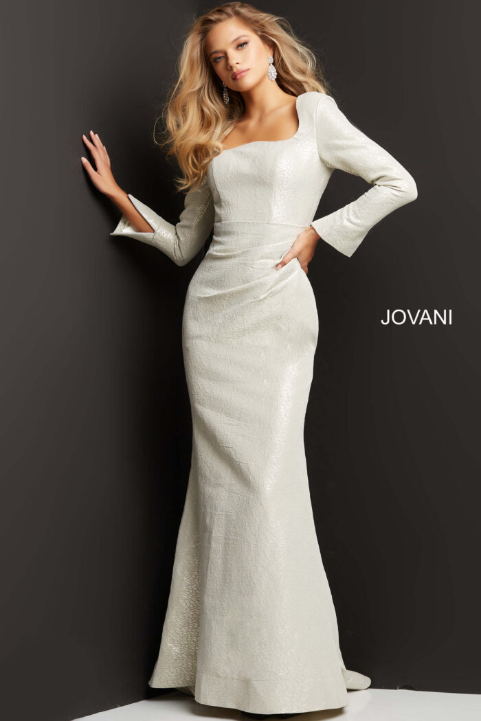 Model wearing Jovani 06996 Cobalt Metallic Long Sleeve Gown