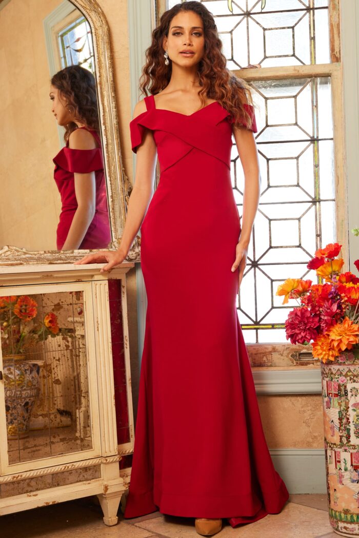 Model wearing Jovani 06999 Red Off the Shoulder Sheath Gown