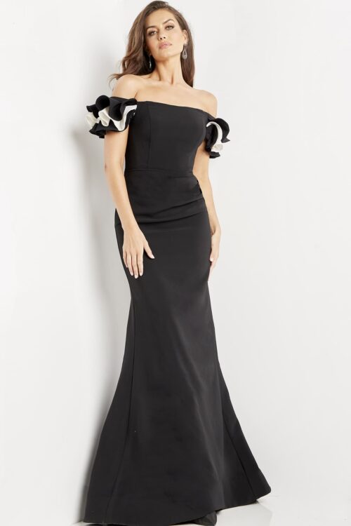Model wearing Jovani 07017 Black and White Off the Shoulder Sheath Dress
