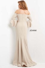 Model wearing Jovani 07065 elegant beige gown showing back view with mermaid silhouette and off-the-shoulder neckline.