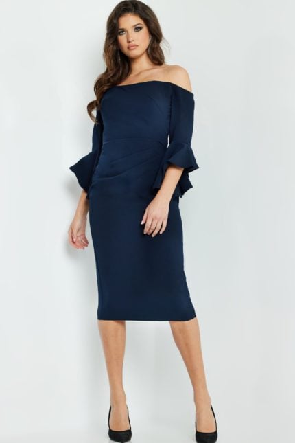 Model wearing Jovani 07066 navy off-the-shoulder midi dress with flounced sleeves.