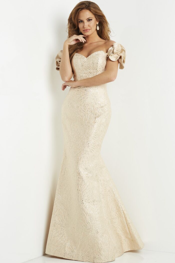 Model wearing Jovani 07154 Gold Off the Shoulder Mermaid Evening Dress