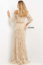 Model wearing Jovani 07195 beige gown with sequin detailing and feather sleeves, back view.