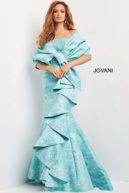 Model wearing Jovani 08093 gown with mermaid silhouette and ruffle details in blue multi-color from the front.