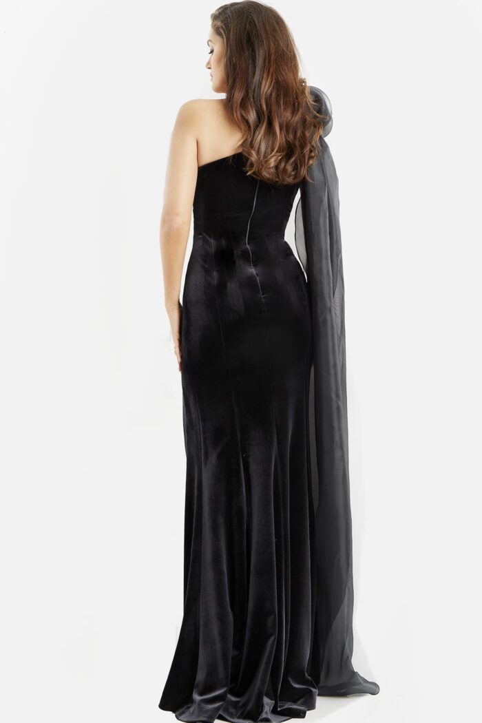Model wearing Jovani 08116 Black Velvet One Shoulder Sheath Dress