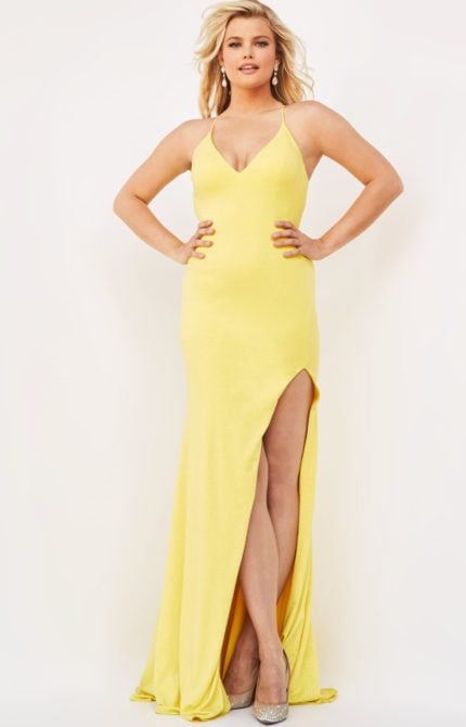 Model wearing Jovani 08153 yellow dress with front view and high slit