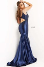 Model wearing Jovani 08157 navy back view featuring cutout.