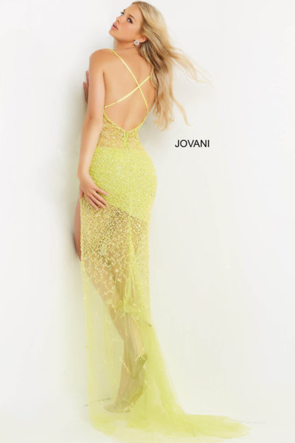 Model wearing Jovani 08225 back view, green gown showing cross straps and sheer detailing