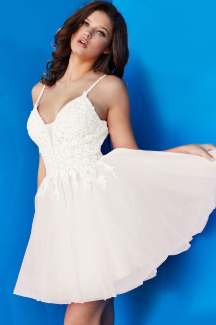 Model wearing Jovani 08273 ivory dress with floral appliques.