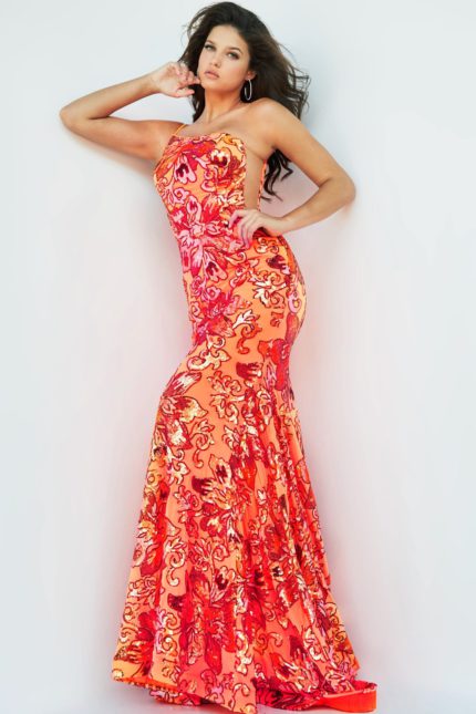 Model wearing Jovani 08460 orange gown with floral embellishments, front view.