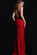 Back view of model wearing Jovani 08531 red fitted gown with low back and high slit.