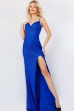 Model wearing Jovani 08531 royal blue fitted gown with sweetheart neckline and high slit.