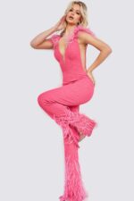 Model seated in Jovani 08554 pink jumpsuit with V-neckline and feather trim.