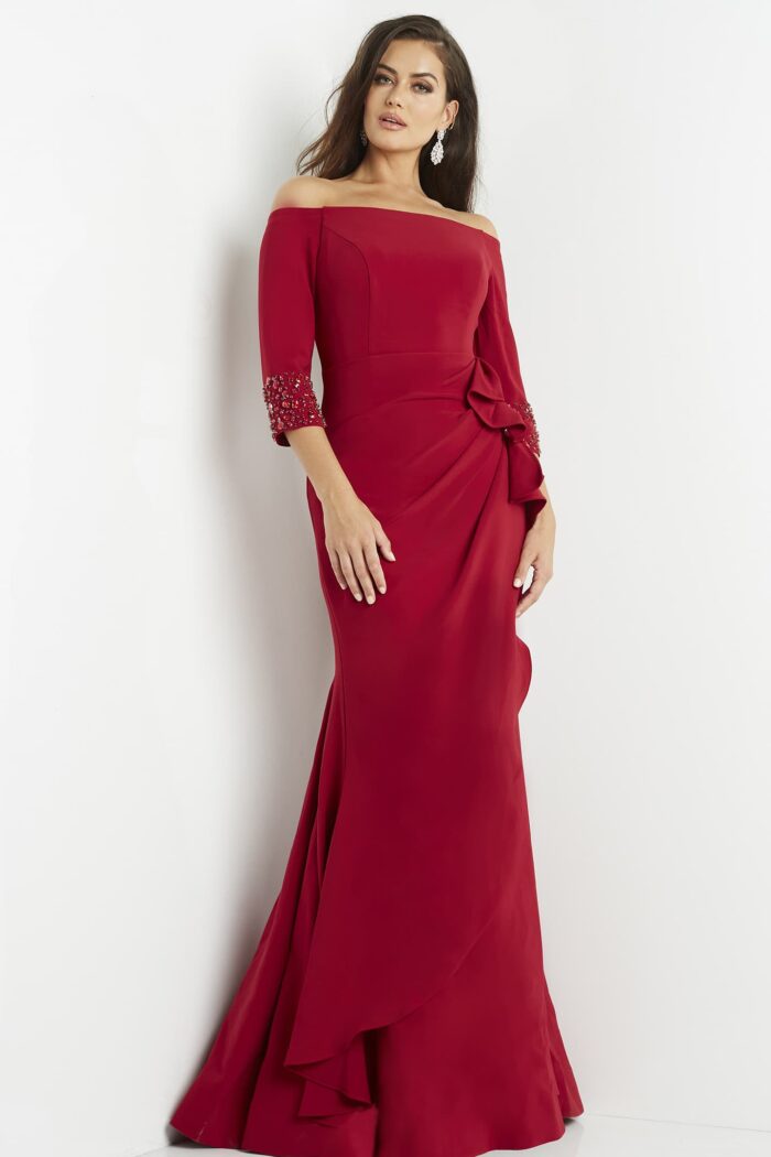 Model wearing Jovani 08699 Cranberry Off the Shoulder Dress