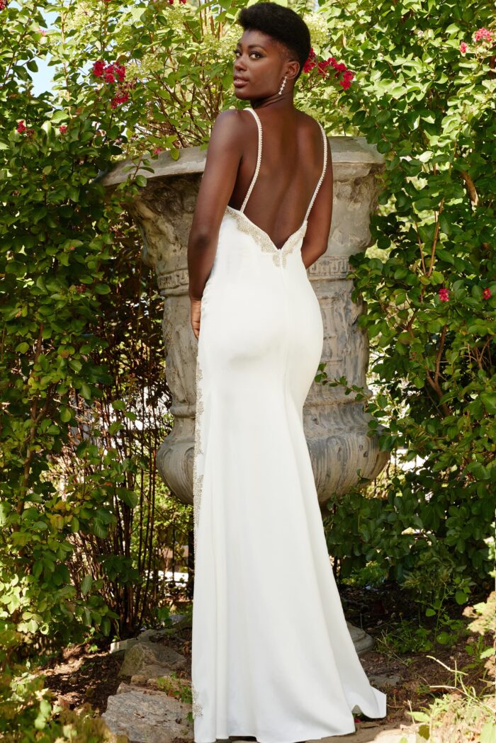 Model wearing Jovani 09009 Off White Plunging Neckline High Slit Dress