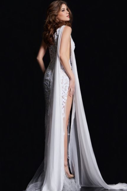 Model showcasing the back view of Jovani 09882 white gown with elegant drape and high slit.