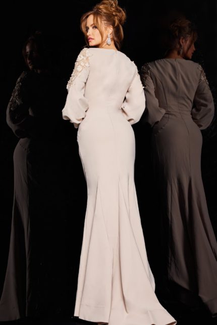 Model wearing Jovani 09470 beige gown with floral applique sleeves, back view.