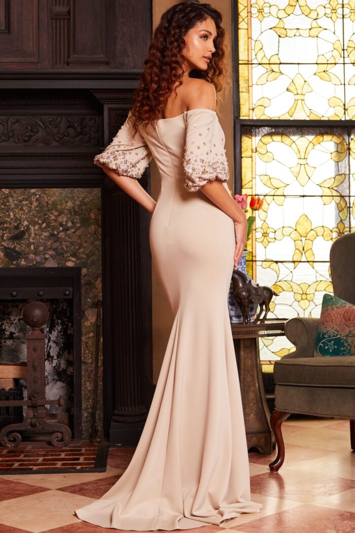 Model wearing Jovani 09516 Cream Off the Shoulder Short Sleeve Evening Gown