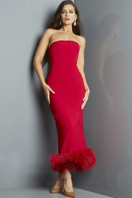 Model wearing Jovani 09630 red dress with feathered hem, front view.