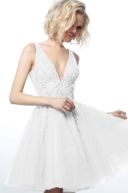 Model wearing Jovani 1774 white dress featuring a deep V-neckline and sparkling embellishments.