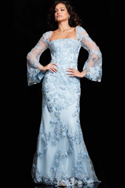 Model wearing Jovani 220520 light blue gown with floral embroidery and sheer sleeves, front view.