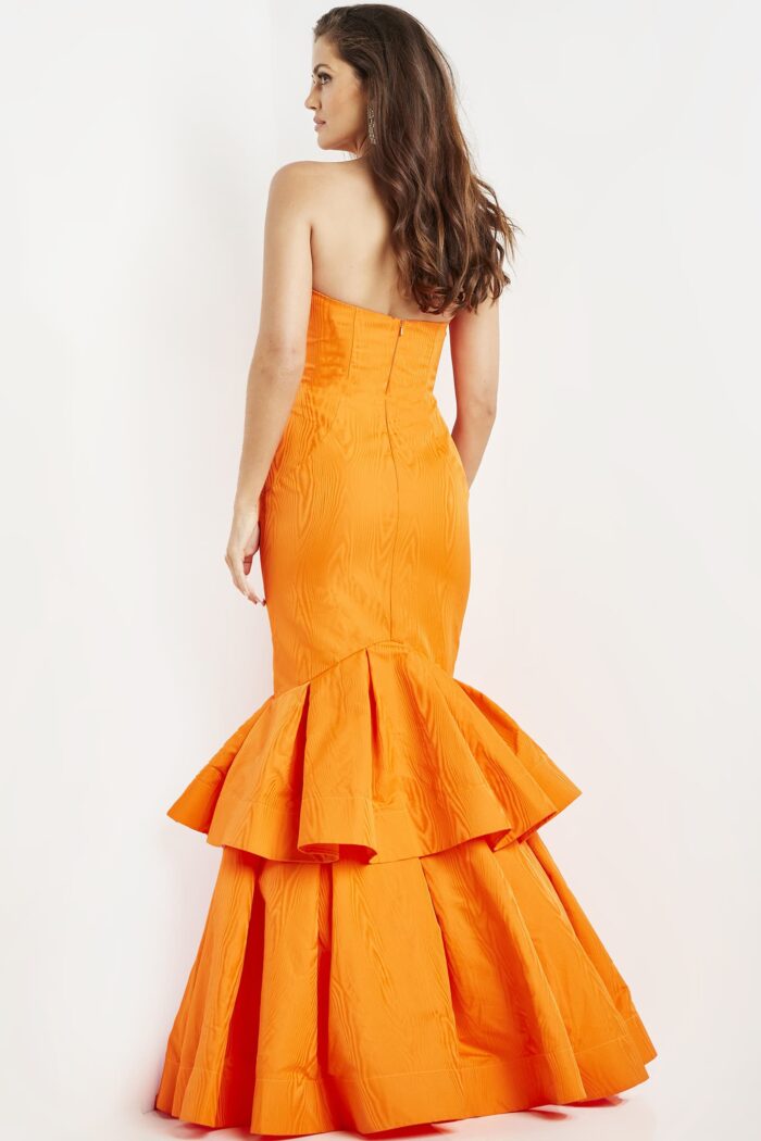 Model wearing Jovani 22921 Orange Strapless Mermaid Dress