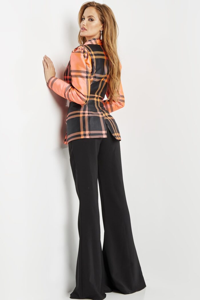 Model wearing Jovani 23002 Orange Black Two Piece Evening Pant Suit