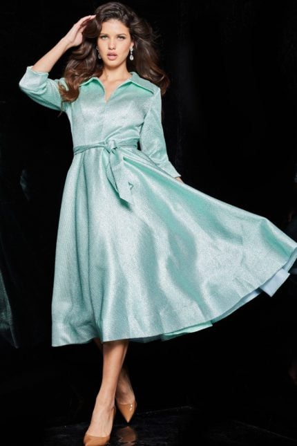 model wearing 23176 mint dress with V-neckline and three-quarter sleeves, front view